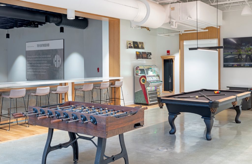 Foosball, pool, and a jukebox adjacent to a media space at Kimball International headquarters