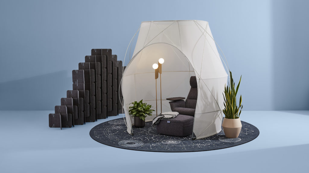 Steelcase Work Tent Pod Tent in tan with brown lounge chair and ottoman inside on circular carpet