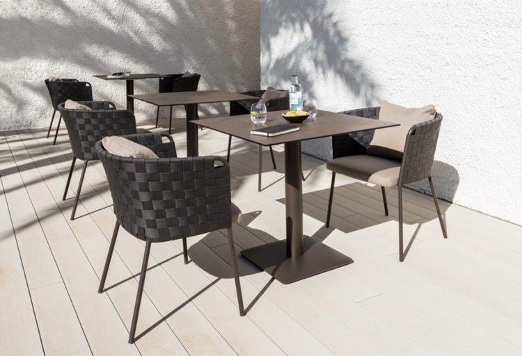 Marina Chair outdoors three chairs in putty and charcoal at table