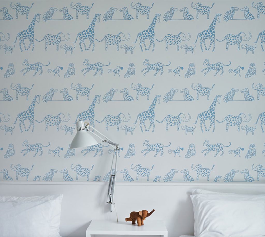 Schumacher Flight of Fancy wallpaper Jungle Jubilee giraffes, elepants, and birds with blue spots on white background