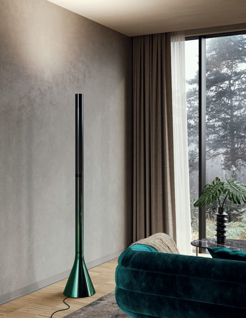 Croma floor lamp metallic green next to green velvet sofa with partial view out window