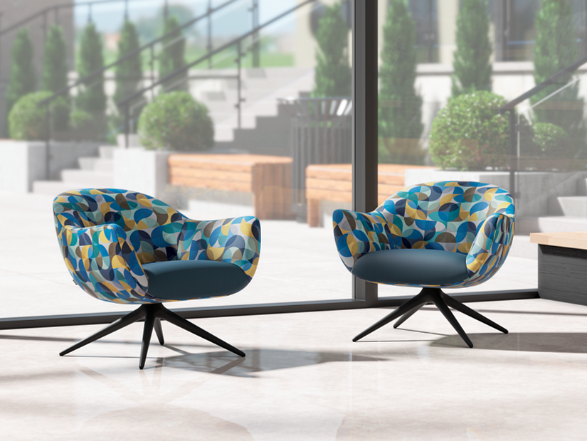 Techne Collection Arc textile half circles in different colors overlapping each other on two lounge chairs in lobby with view of outside