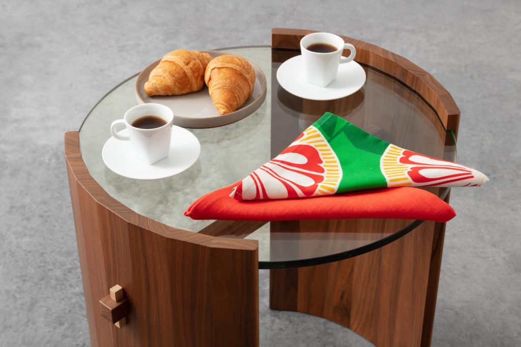 Launch Pad MoCollection coffee table with coffee and croissants and colorful napkins