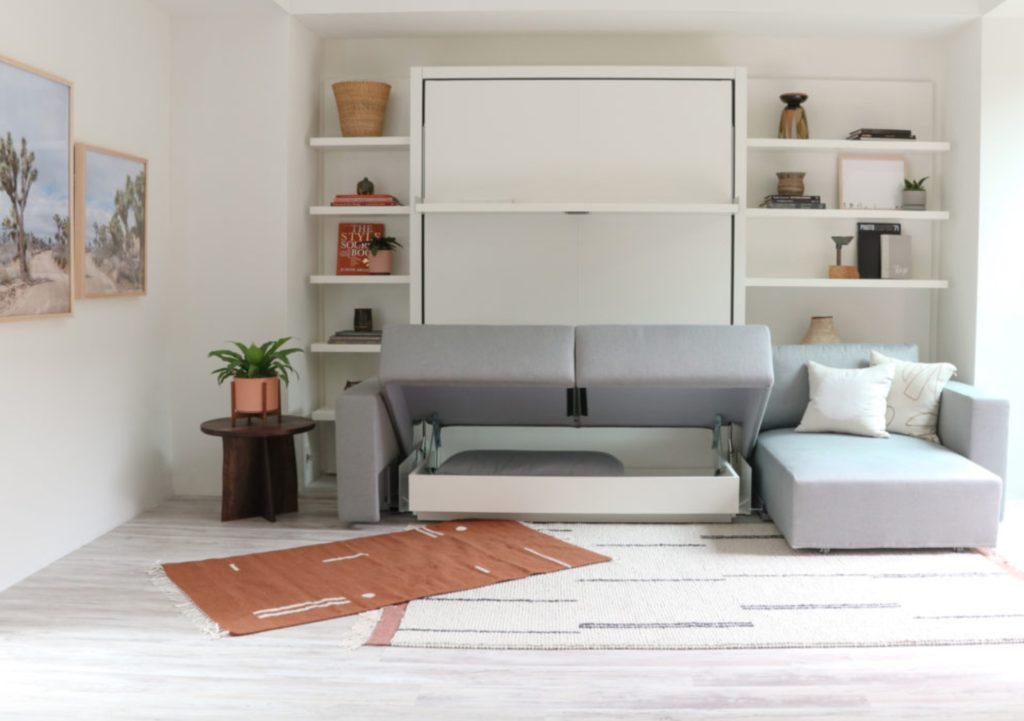 Swing in up position showing storage beneath sofa and shelves behind