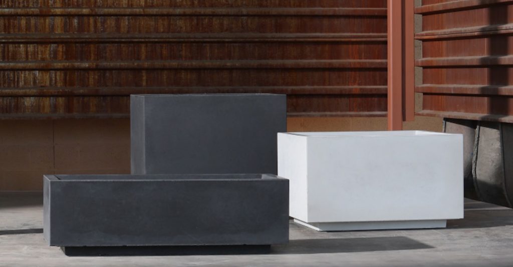 Aspect planters three sizes two charcoal one white in front of wooden wall
