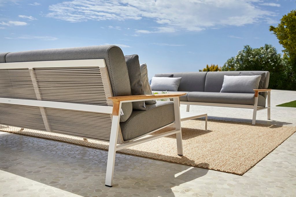 Point City Collection low/side view of two sofas with gray upholstery outdoors