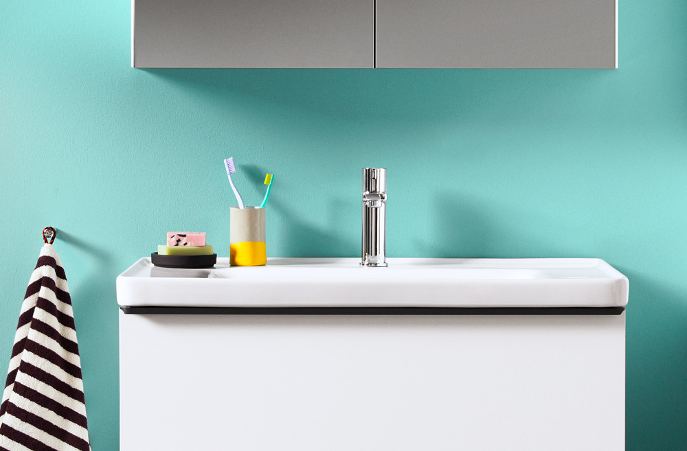 D-Neo Pop with minimalist sink against aqua colored wall