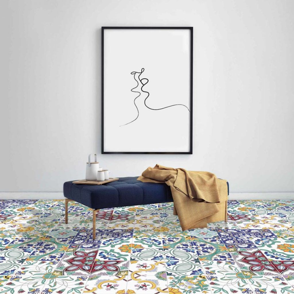 Mèlange Ceramica tiles on floor in living room with blue ottoman