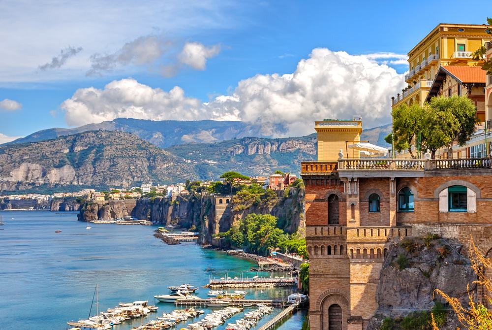 Blu Ponti view of Sorrento with ocean, hills, and building