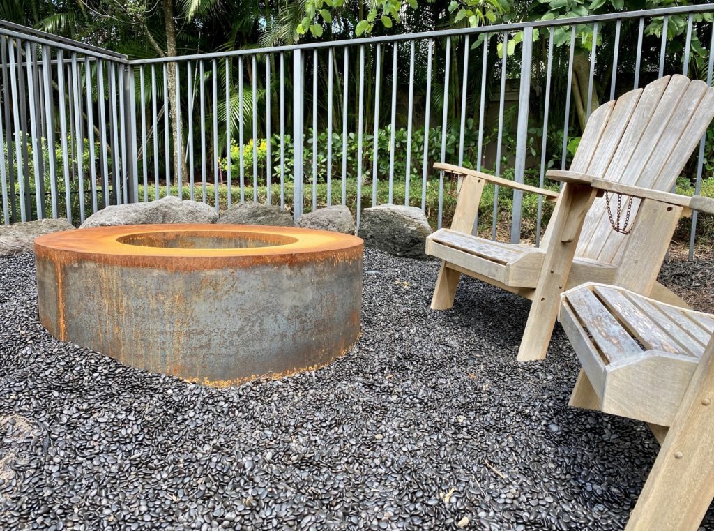 MK Designs' fire pit aging to patina in outdoor gravel patio