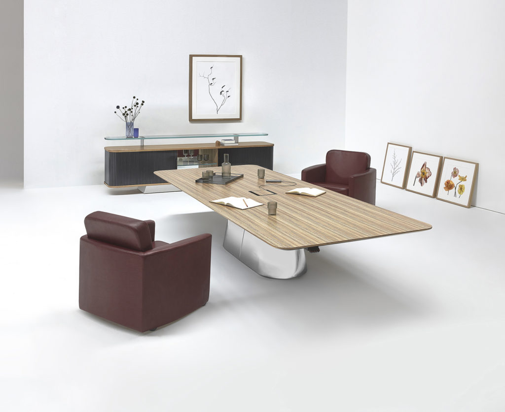 Vox LCS table in office with two maroon colored lounge chairs