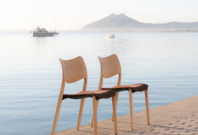 two chairs in front of the ocean