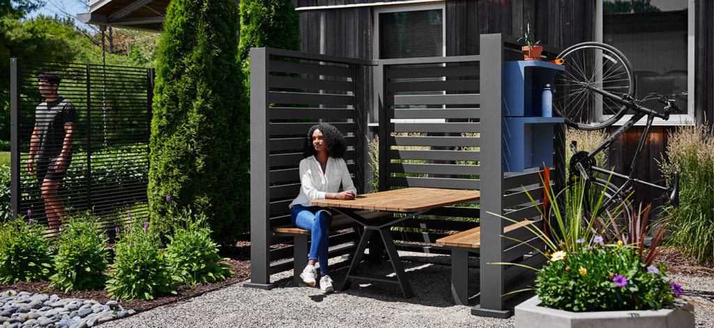 Outdoor nook with table, shelves, and bike rack