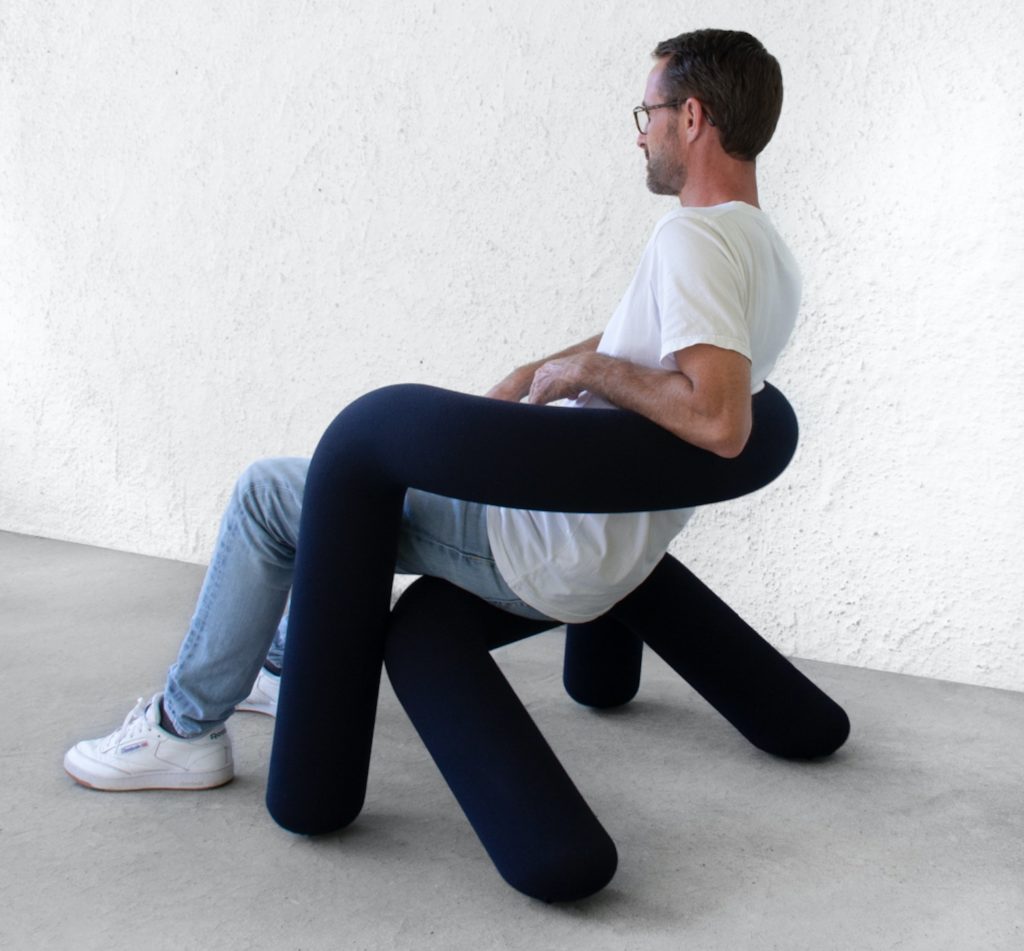 Extra Bold chair with man sitting