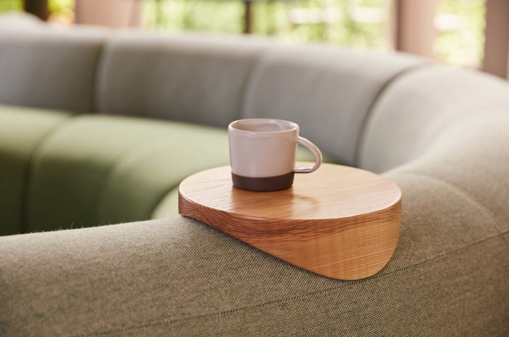 Logger sofa detail with espresso cup on coaster