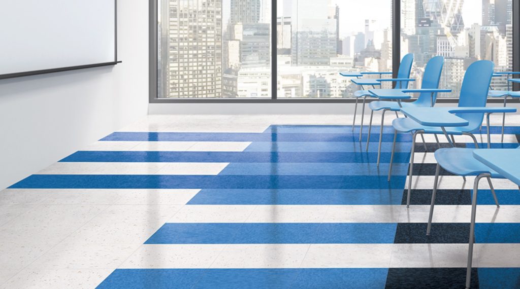 Armstrong Flooring VCT floor in striped white/blue in classroom with city view