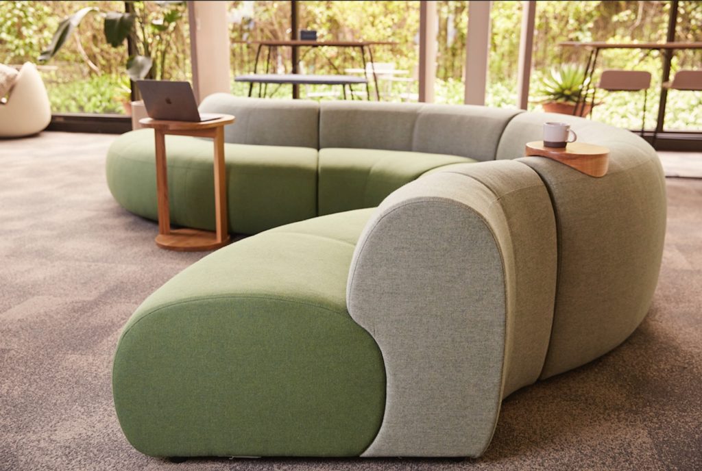 Modular Seating view from side green/gray in open workplace