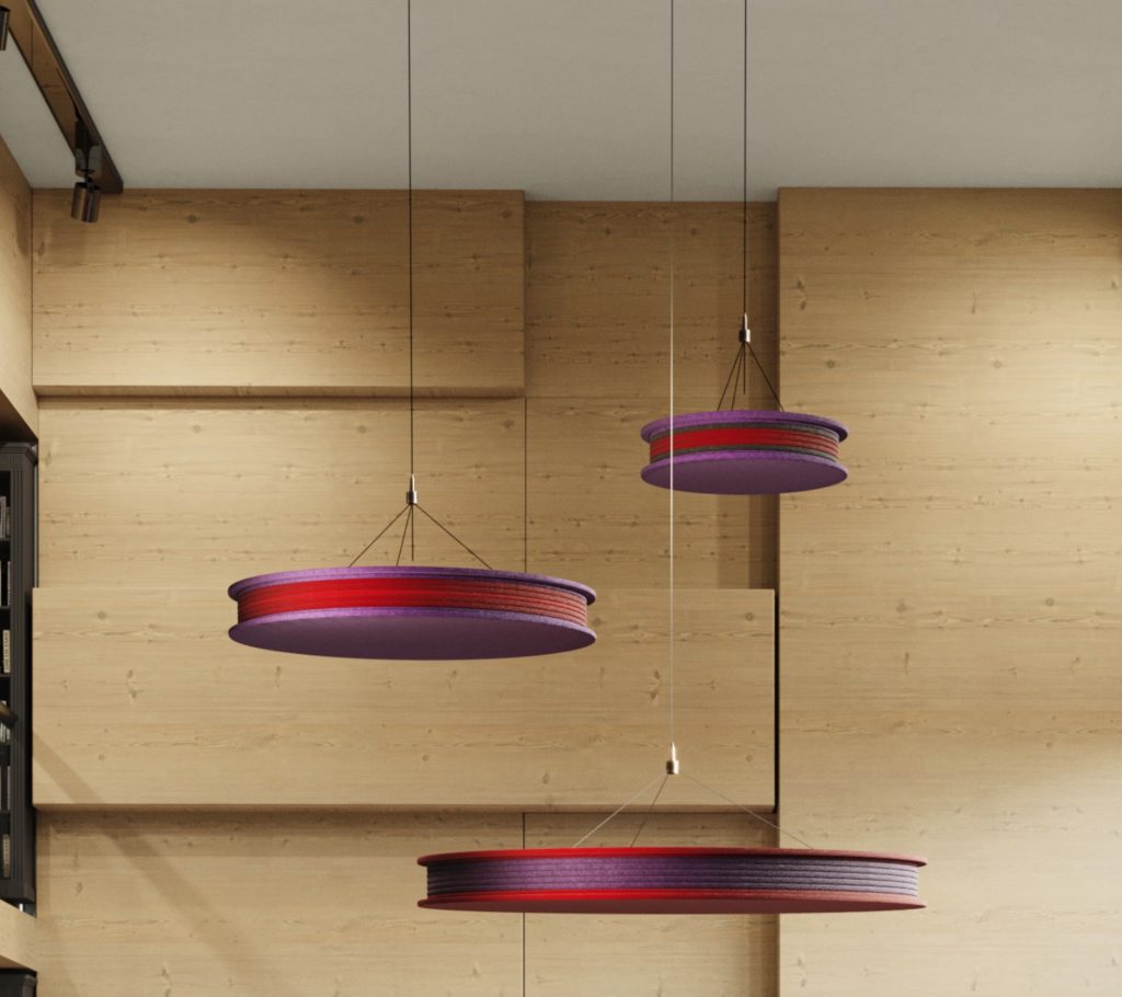 Red and purple fixtures with library wall in background