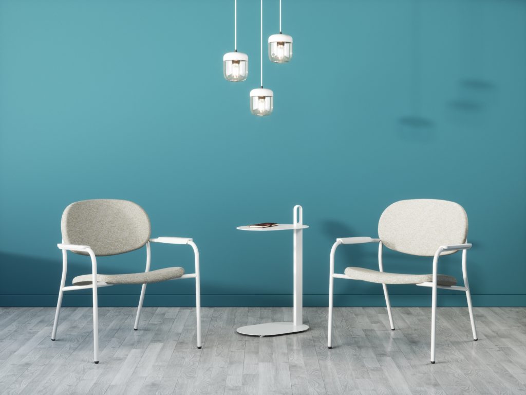 Three Acorn pendant lights above laptop table with chairs