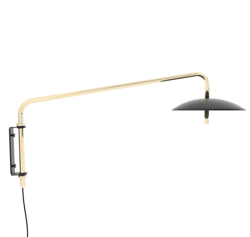 sconce with black shade and brass arm