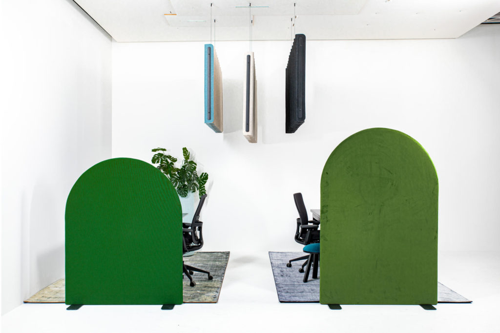 Arc-shaped room dividers in forest green and kermit the frog gren with partial view of chairs and carpet