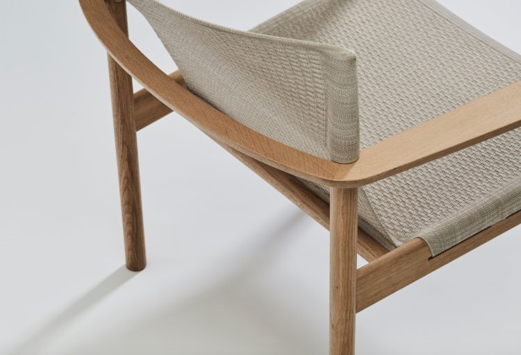 Evo chair rear view, natural wood and light textile