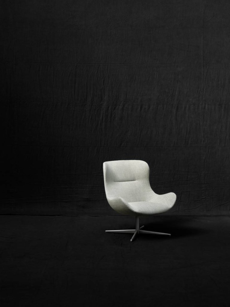 Light gray chair on black background