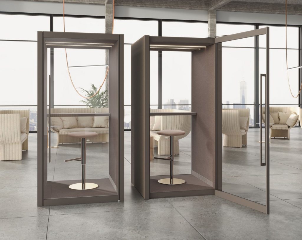 side by side phone booth pods surrounded by designer lounge chairs