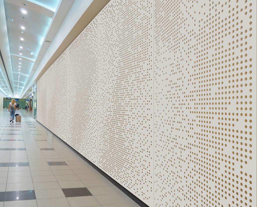 Metals in Motion several panles in white with small perforated circles in airport passageway