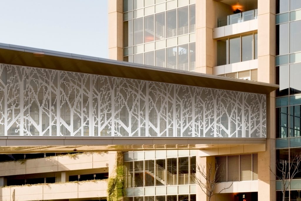 Móz Metals in Motion panel with forest scene as cladding on building elevated passage way