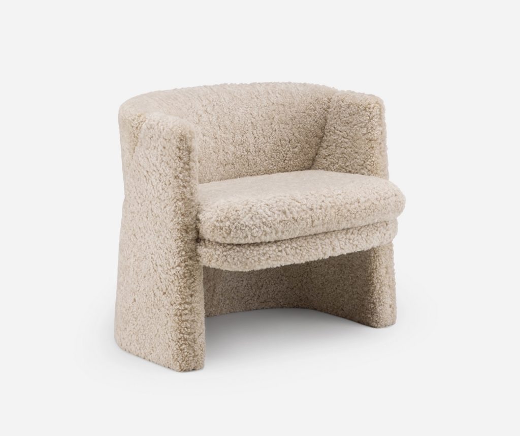fuzzy lounge chair with upholstery like a sheepdog