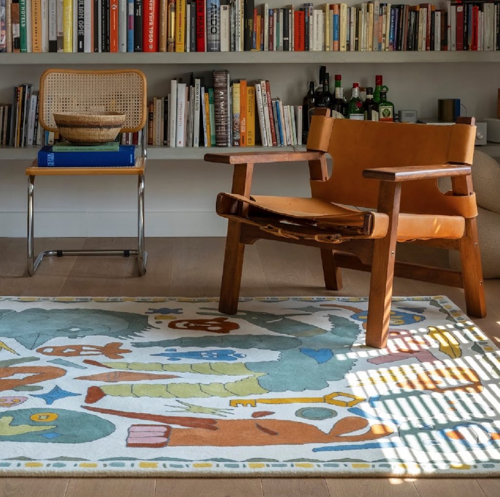 Troupe rug on floor of home library with chairs