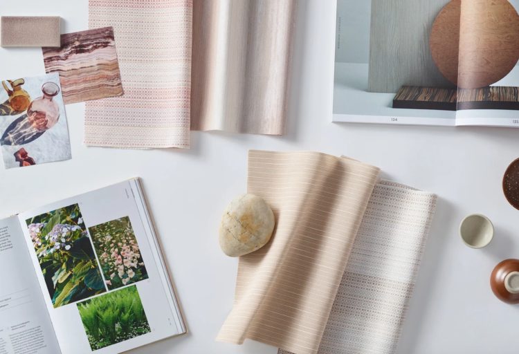 mood board for privacy curtains with natural objects like a rock, image of trees i a book, and several swatches of pink and white fabric