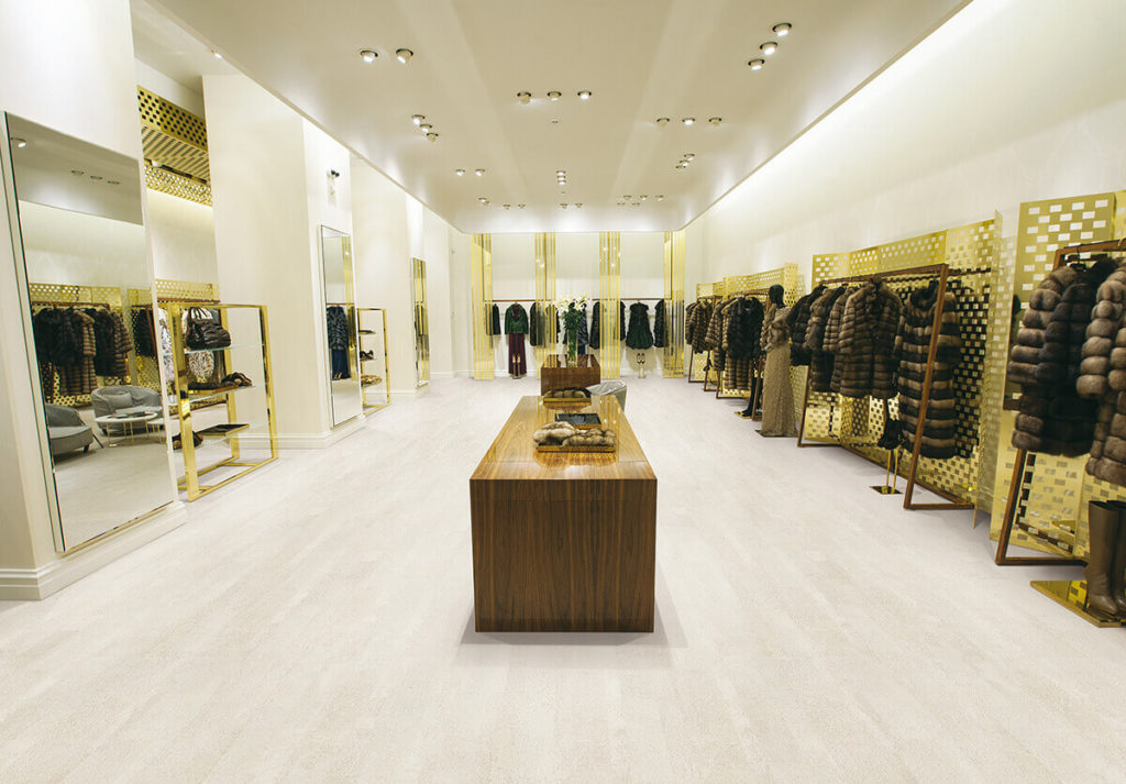 Plank cork flooring in very light tone in fashionable woman's clothing store