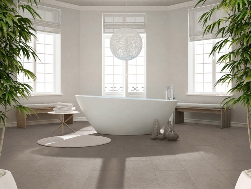 large-format porcelain tiles on bathroom floor in medium gray color