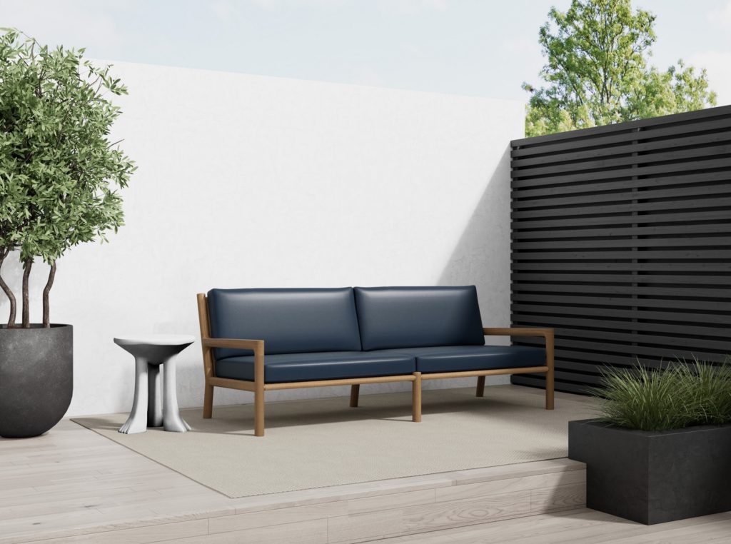 Navy blue vegan leather fabric on an outdoor sofa on small patio