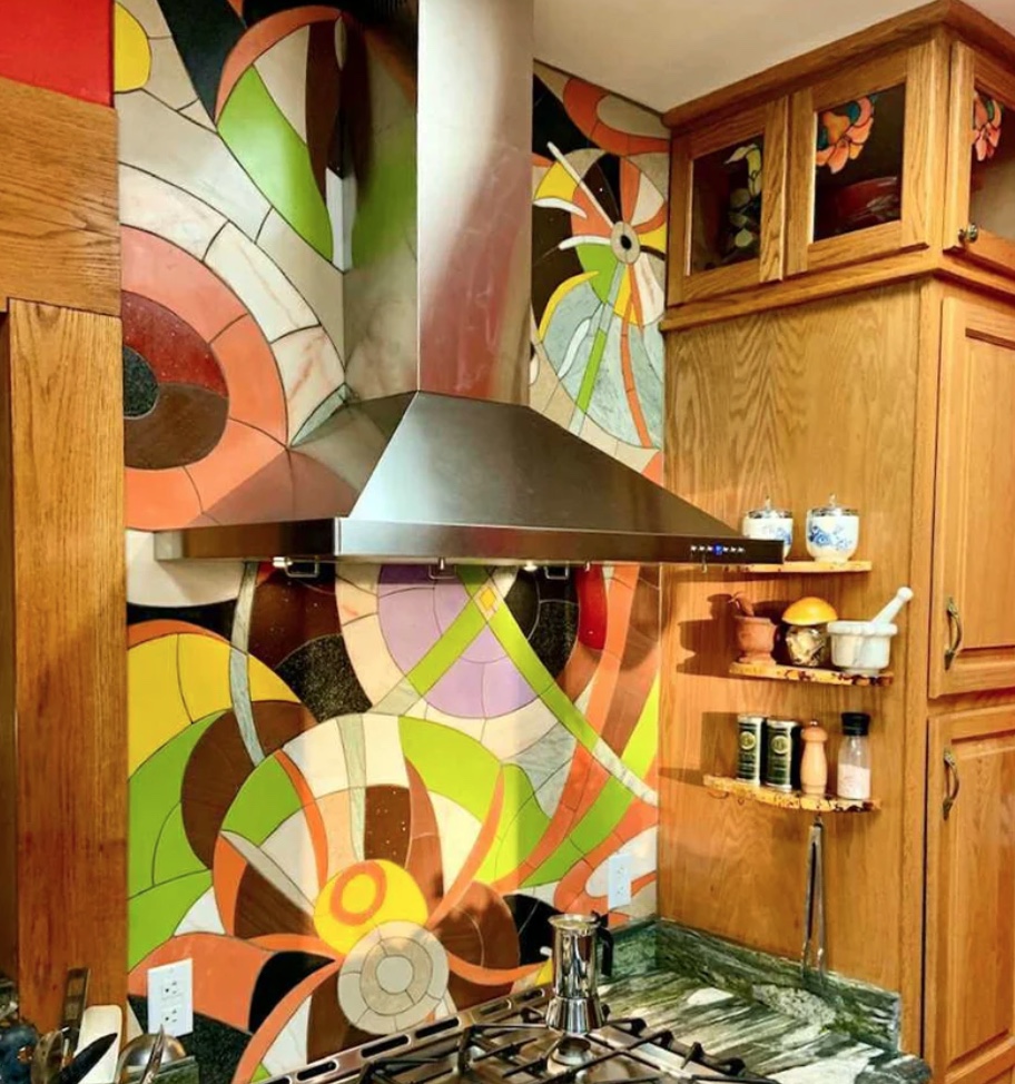 mosaic backsplash with an abstract floral theme