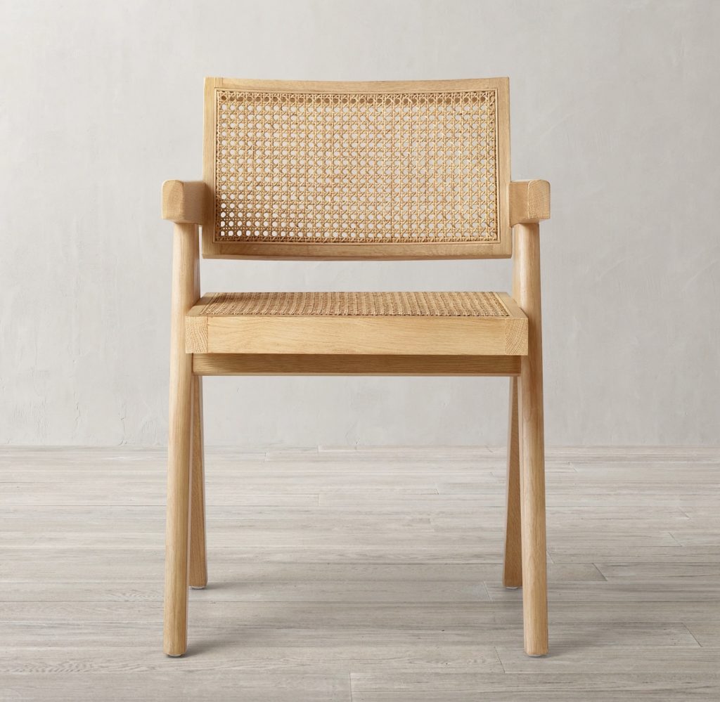 front view of a cane dining chair in light oak