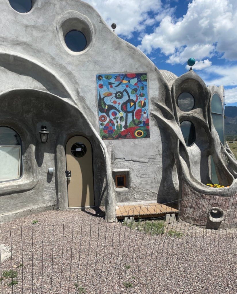 Miró mosaic at the entrance to an unusual adobe builiding/home