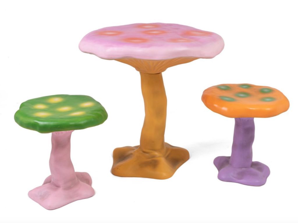 Table and chair garden set in the form of fanciful and colorful mushrooms