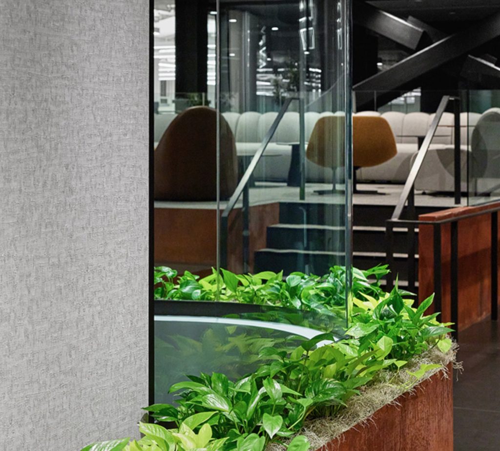Fino curved glass detail with planter box beneath