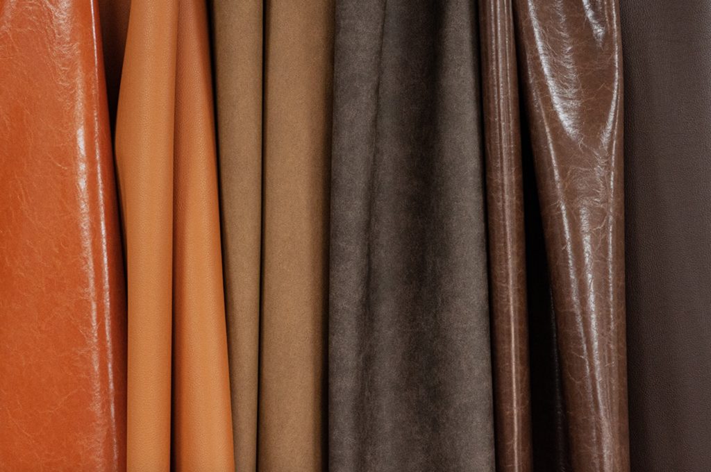 Nassimi resilience PFAS-free faux-leather textile in earthy colors from orange to rust to brown