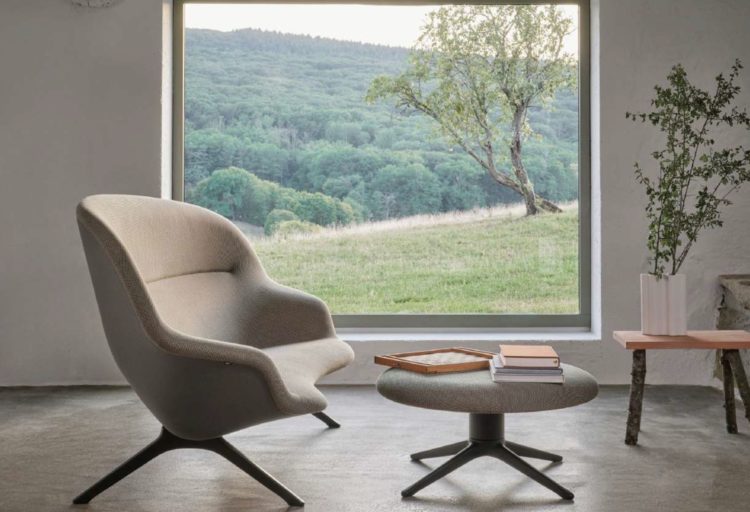 Abalon sofa with ottoman in front of picture window with beautiful landscape