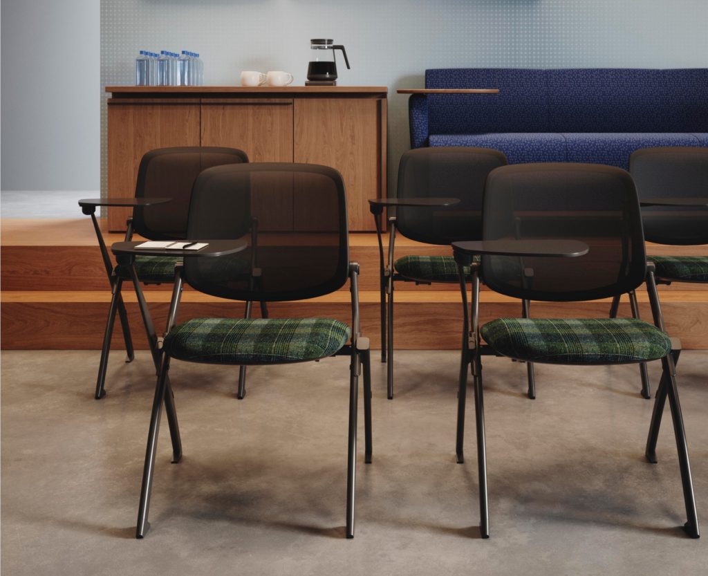 Five chairs with plaid-style upholstery in meeting room