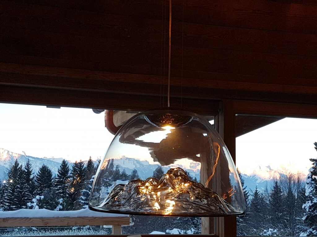 Pendant at chalet with mountains in the distance