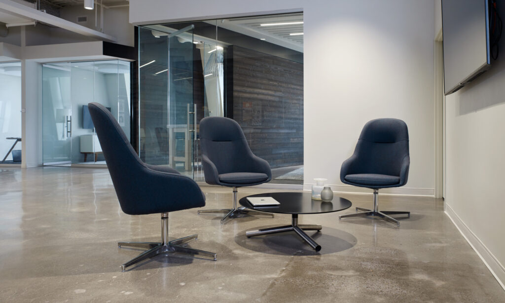 Martini Lounge in slate blue, three chairs in office open space