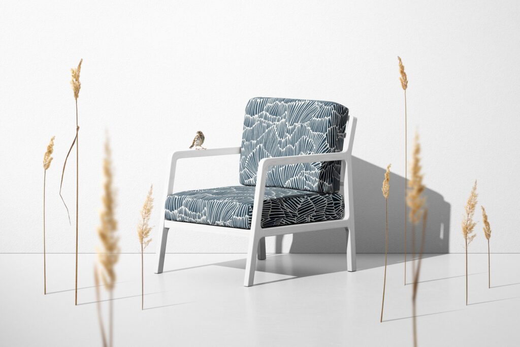 Flashdance fabric like dense palm fronds on chair with actual bird on chair arm