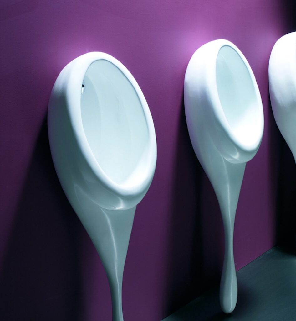 Spoon urinal against purple wall