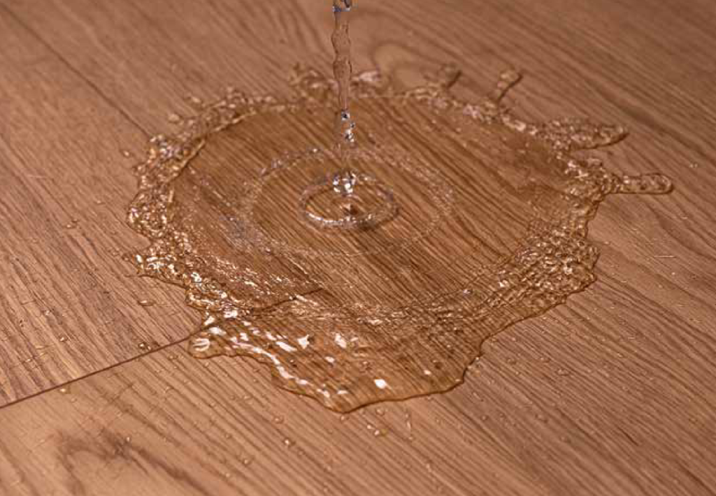 detail of floor with water being spilled on it