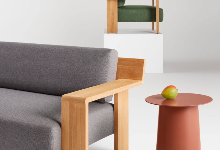 BluDot Ridge chair and sofa with table bearing fruit